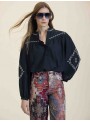 Blusa bordada detalle volante